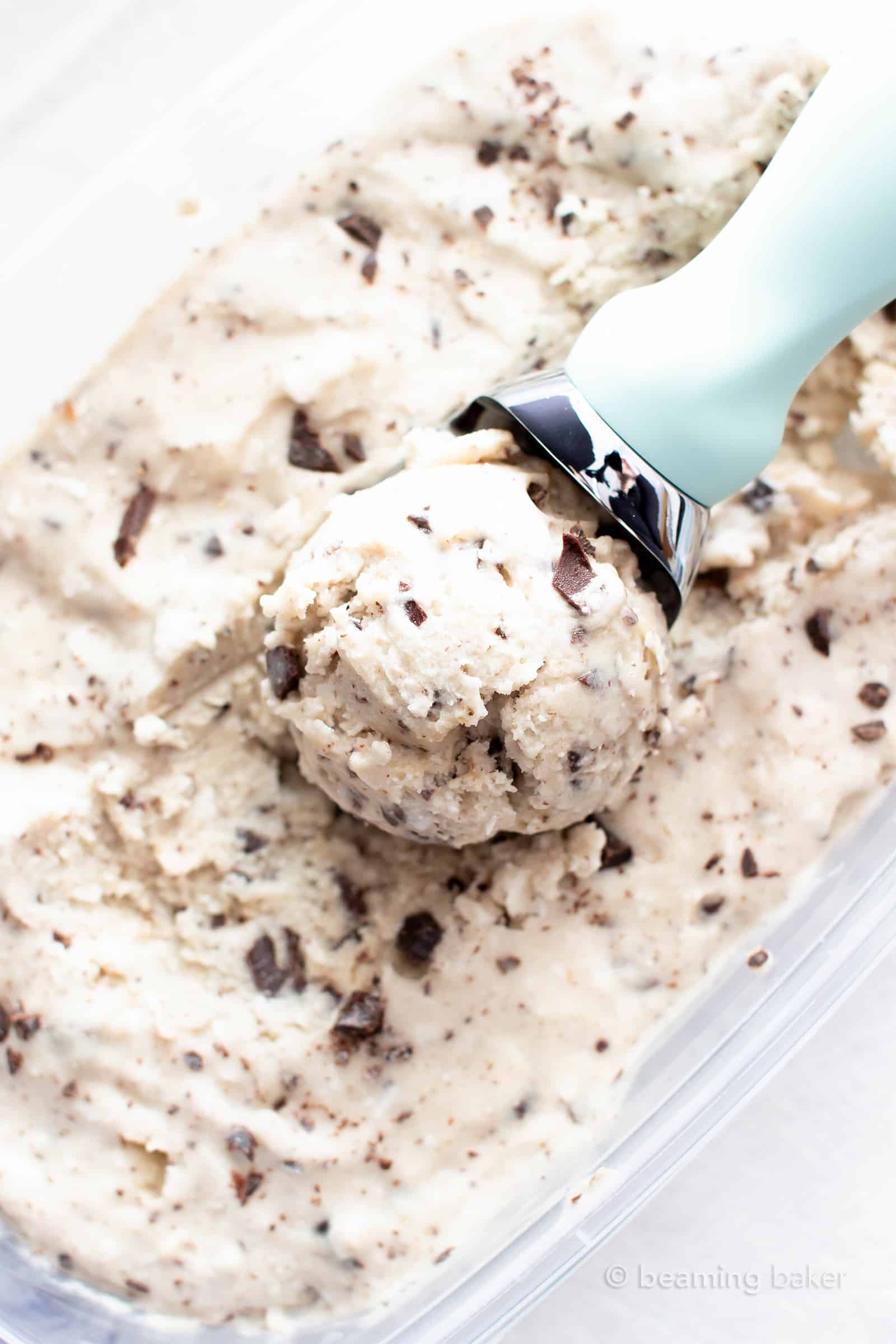Coconut Chocolate Chip Vegan Ice Cream Recipe: this delicious vegan ice cream recipe is wonderfully rich ‘n creamy! The best homemade vegan ice cream—packed with coconut & chocolate chips, no churn. #Vegan #IceCream #Coconut #ChocolateChip #VeganIceCream | Recipe at BeamingBaker.com
