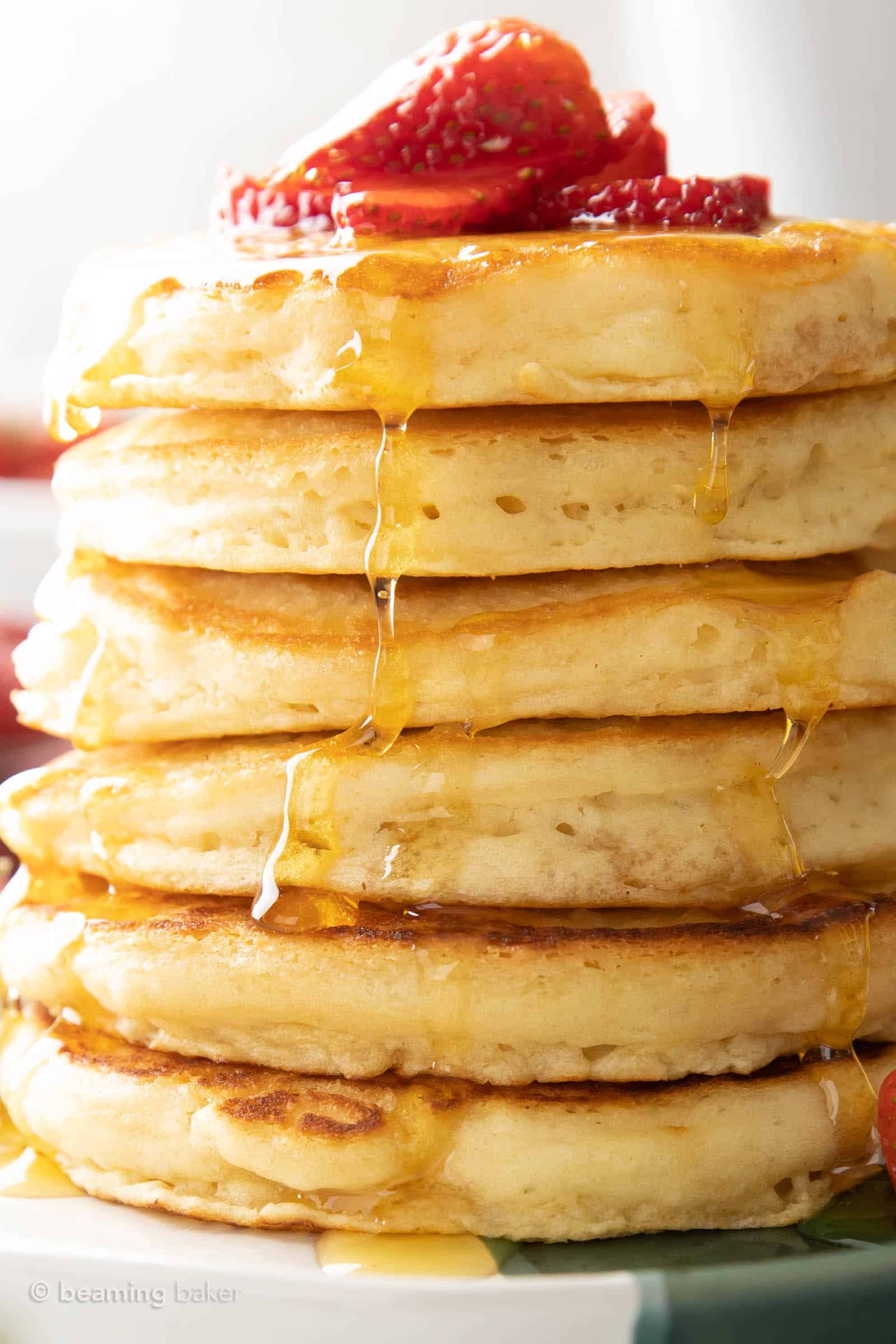 showcasing how to make strawberry pancakes with this stack of extra thick pancakes