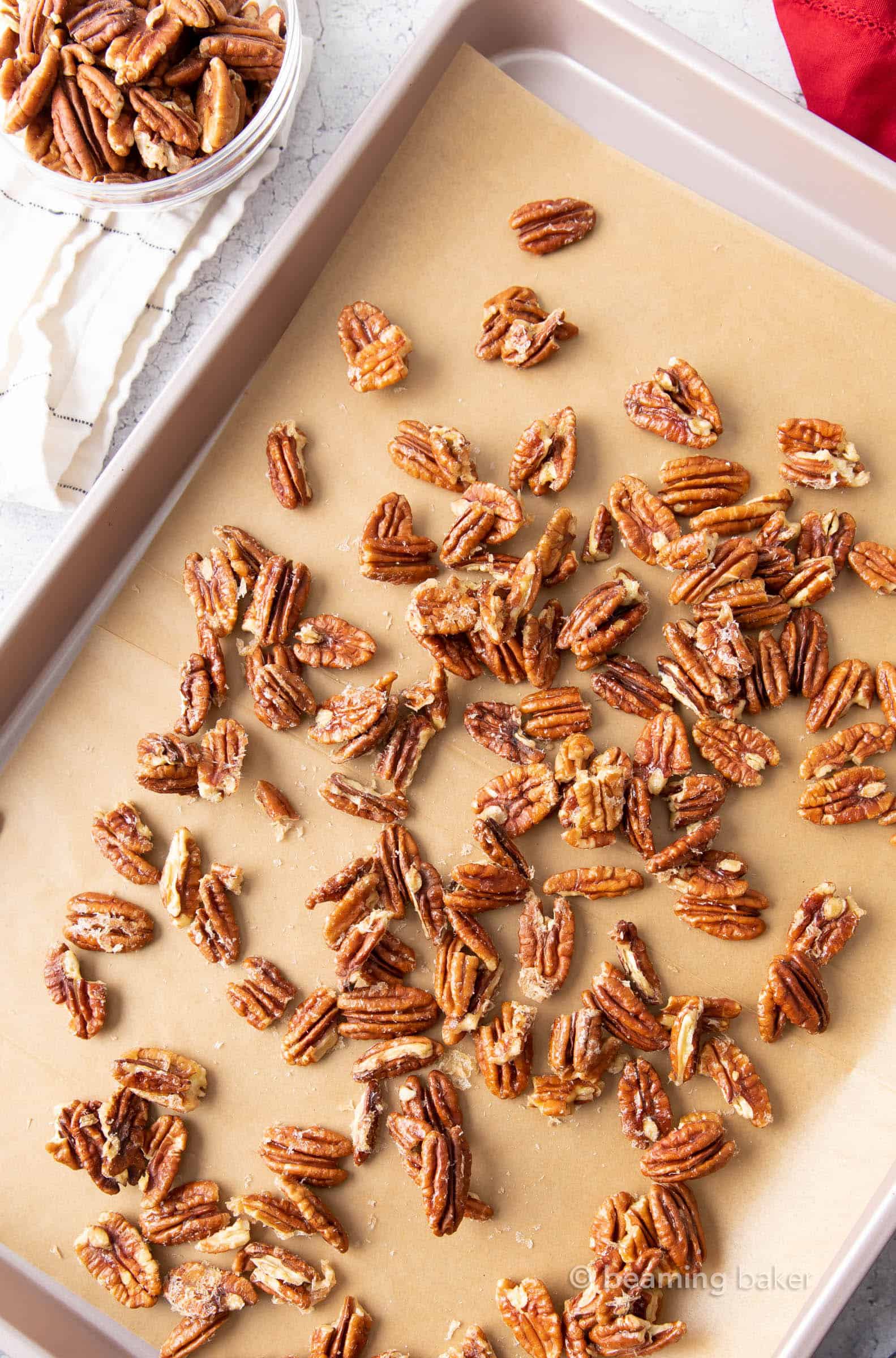 Learn how to make keto candied pecans and cool them on a baking sheet