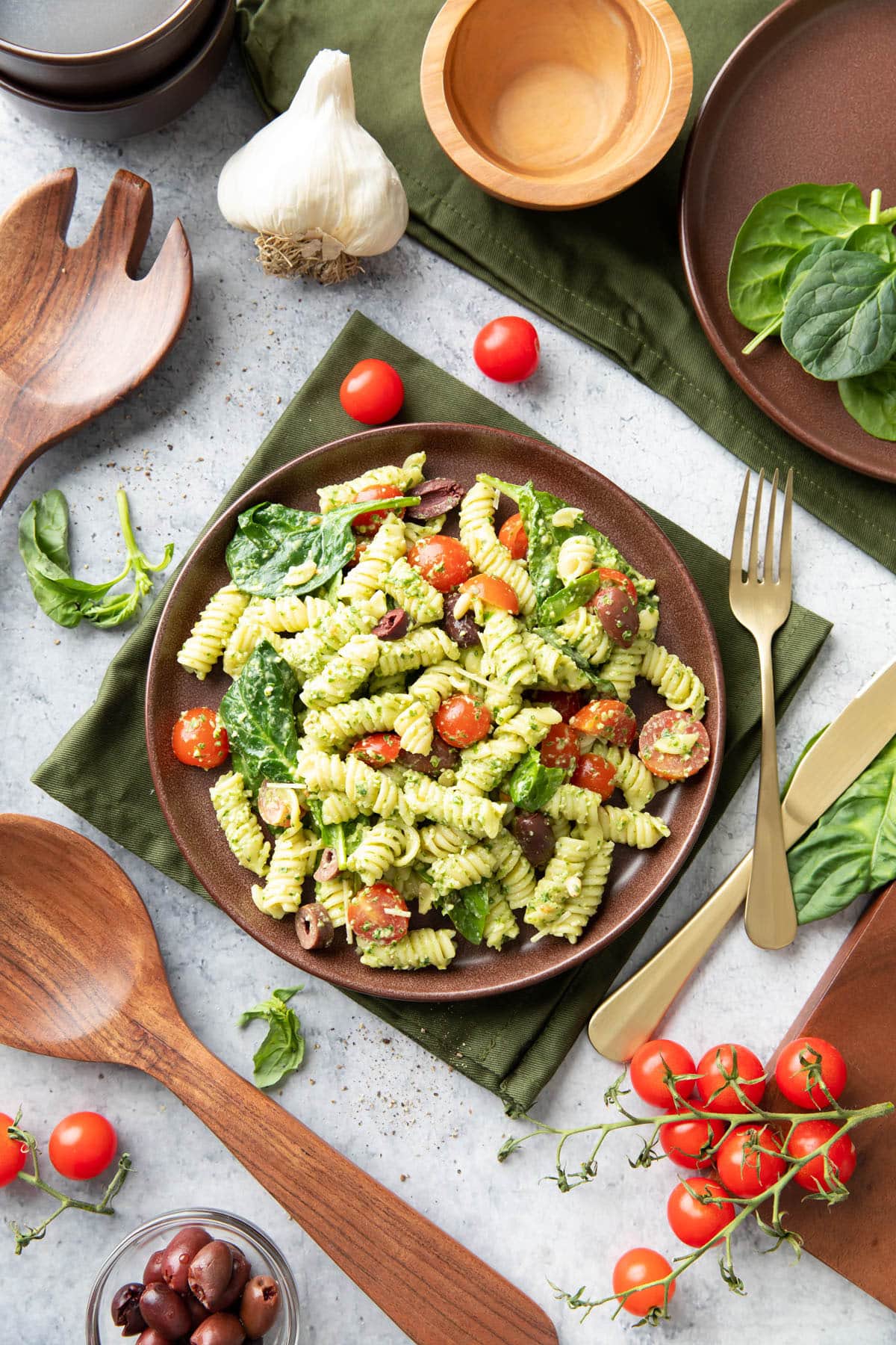 pesto pasta salad served in a brown plate